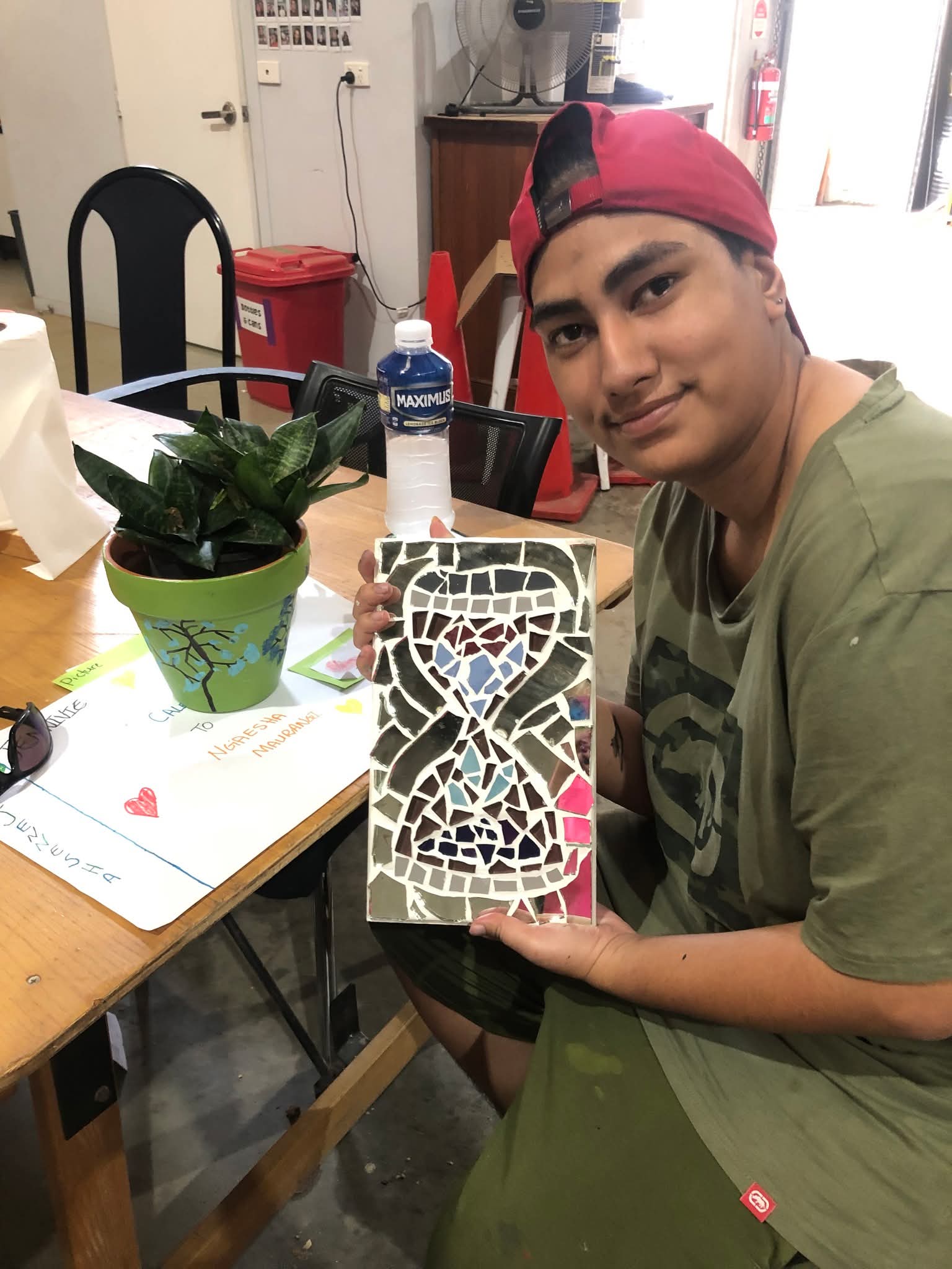 Participant showing completed mosaic art